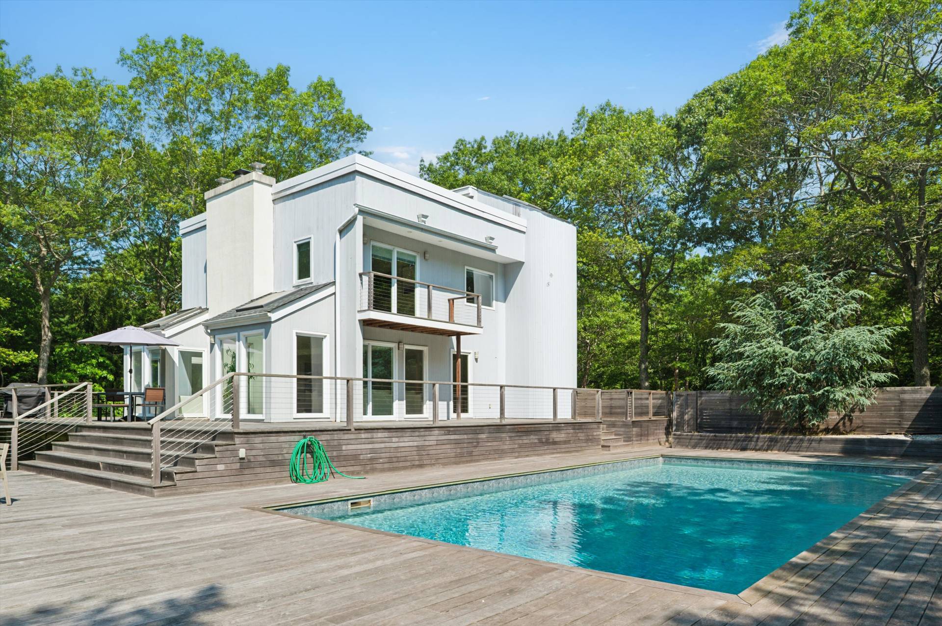 2 Jodys Path East Hampton, NY 11937 - Photo 6 of 43 a front view of a house with a garden