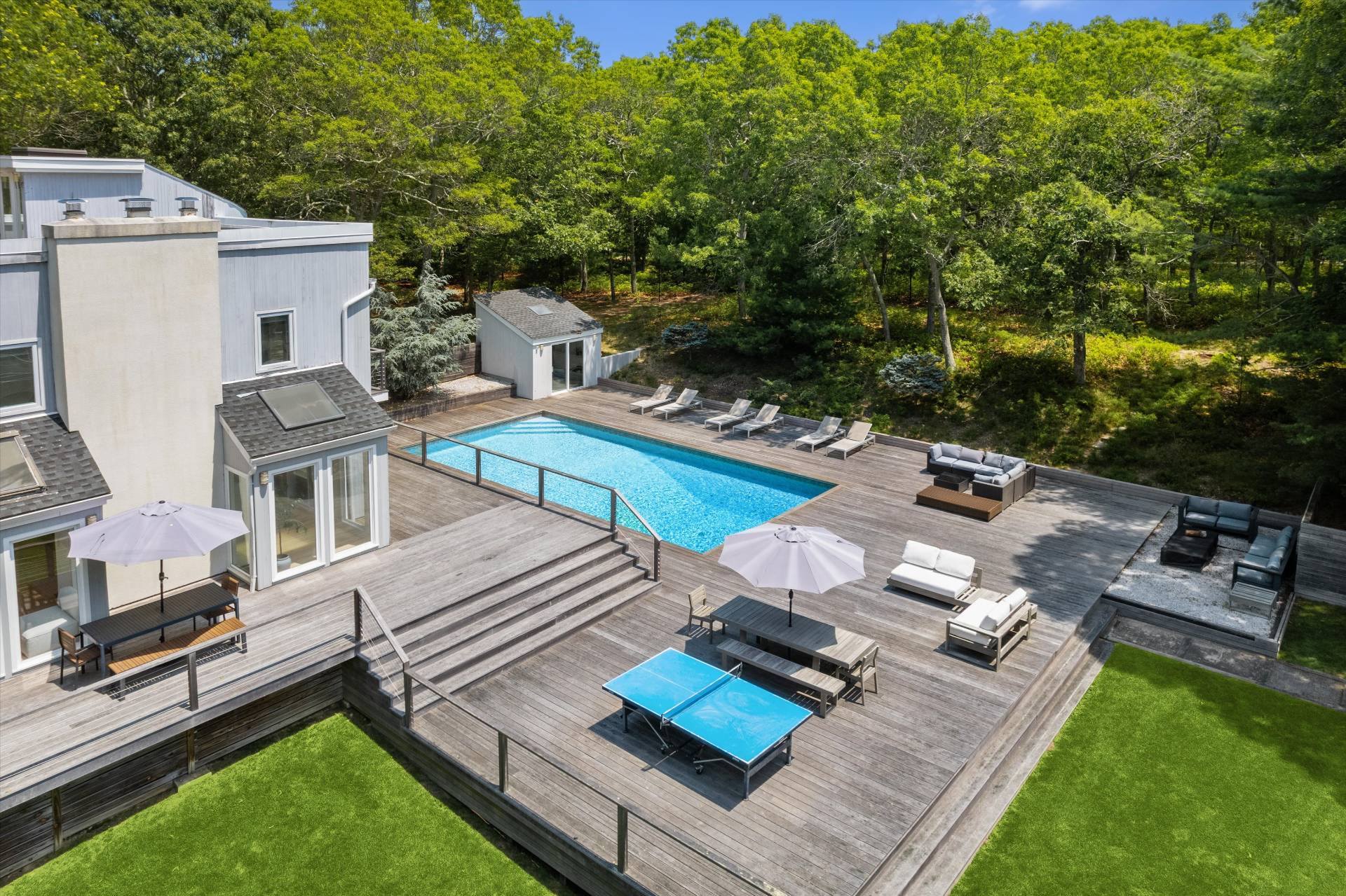 2 Jodys Path East Hampton, NY 11937 - Photo 8 of 43 a view of a house with backyard sitting area and garden