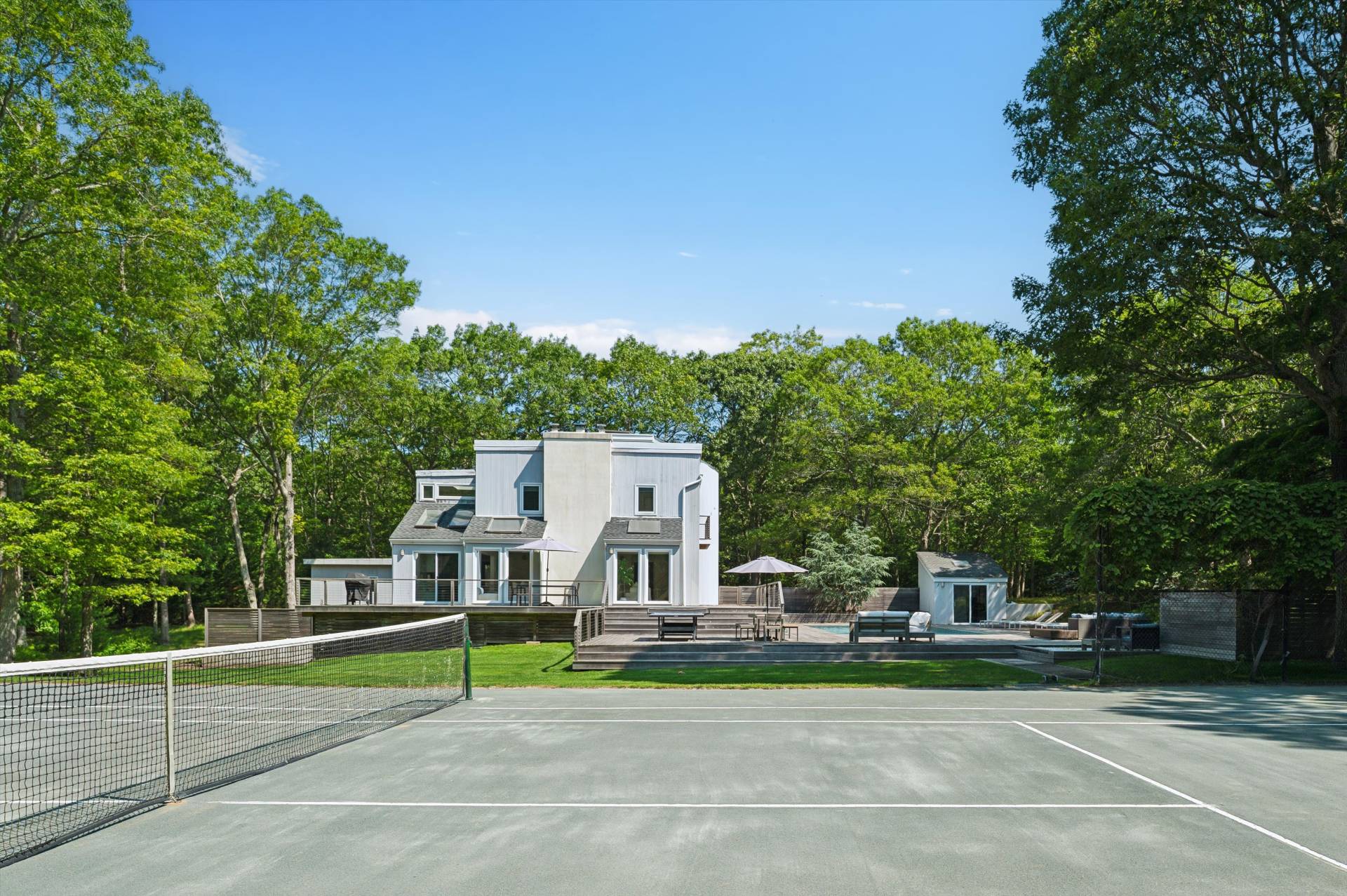 2 Jodys Path East Hampton, NY 11937 - Photo 9 of 43 a view of a house with a yard and large trees