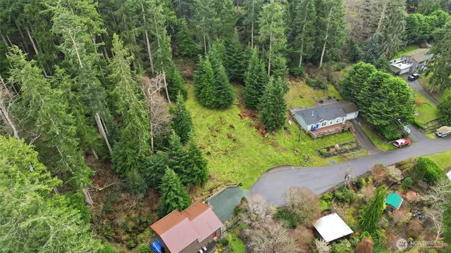 an aerial view of a house with a yard
