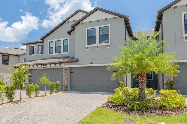 an aerial view of a house with a garden