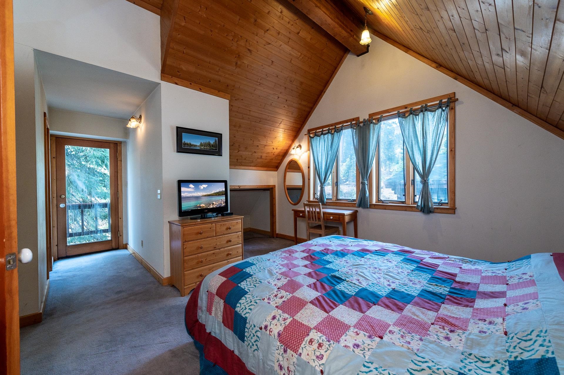 1191 Snow Crest Road Alpine Meadows, CA 96146 - Photo 11 of 21 a bedroom with a bed and a dresser next to a window