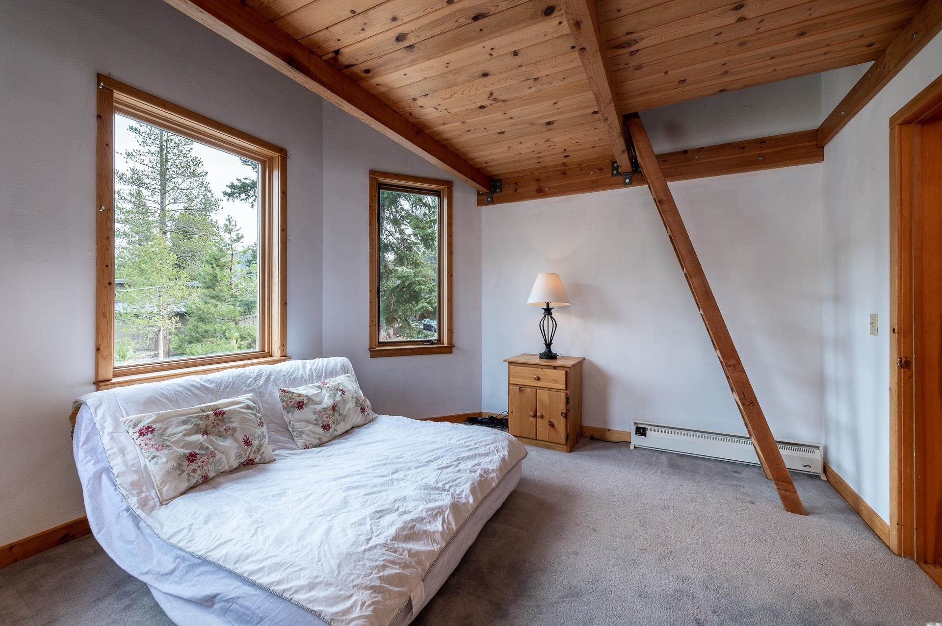 1191 Snow Crest Road Alpine Meadows, CA 96146 - Photo 12 of 21 a bedroom with a bed and a window
