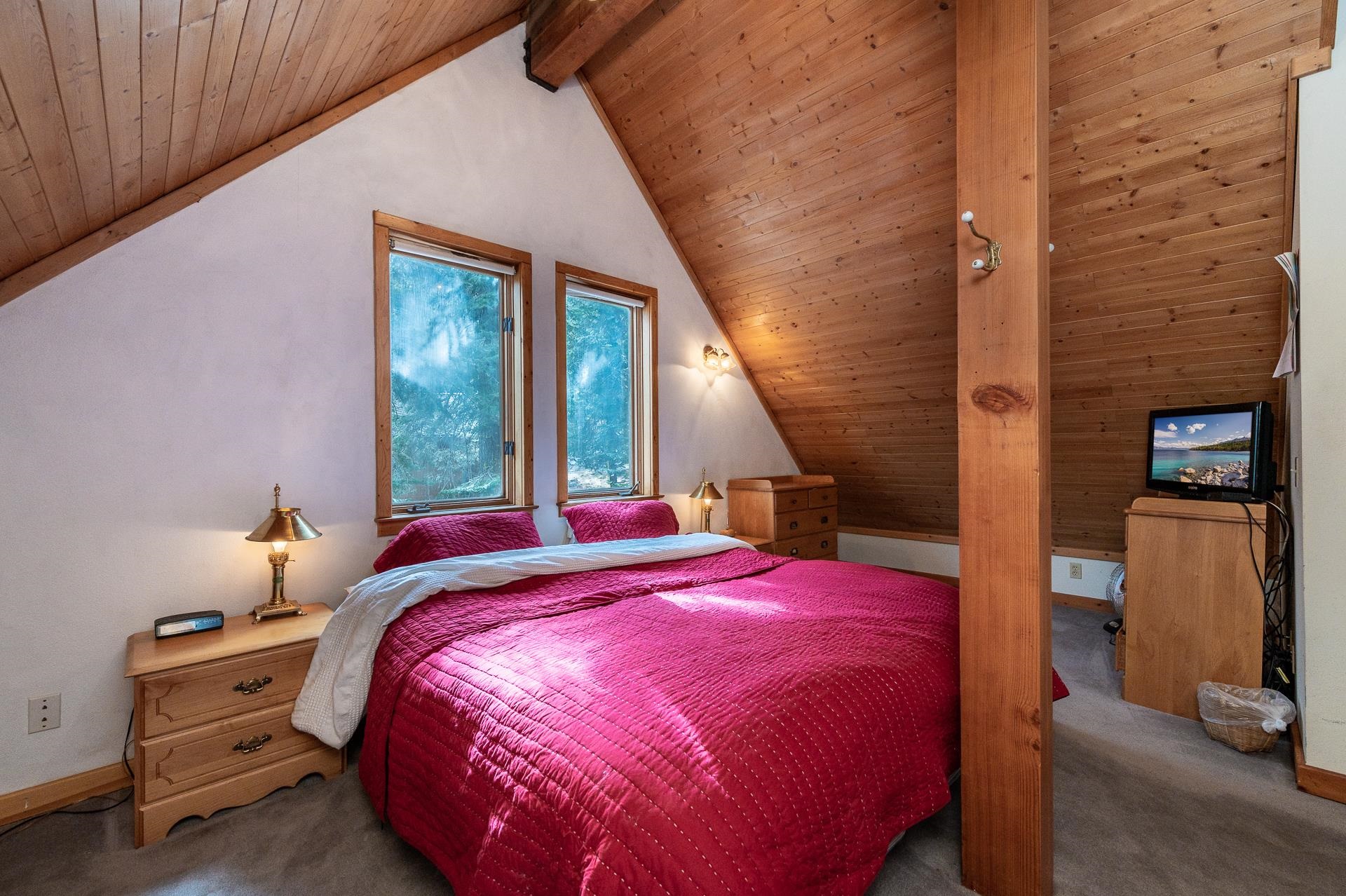 1191 Snow Crest Road Alpine Meadows, CA 96146 - Photo 16 of 21 a bed sitting in a bedroom next to a window