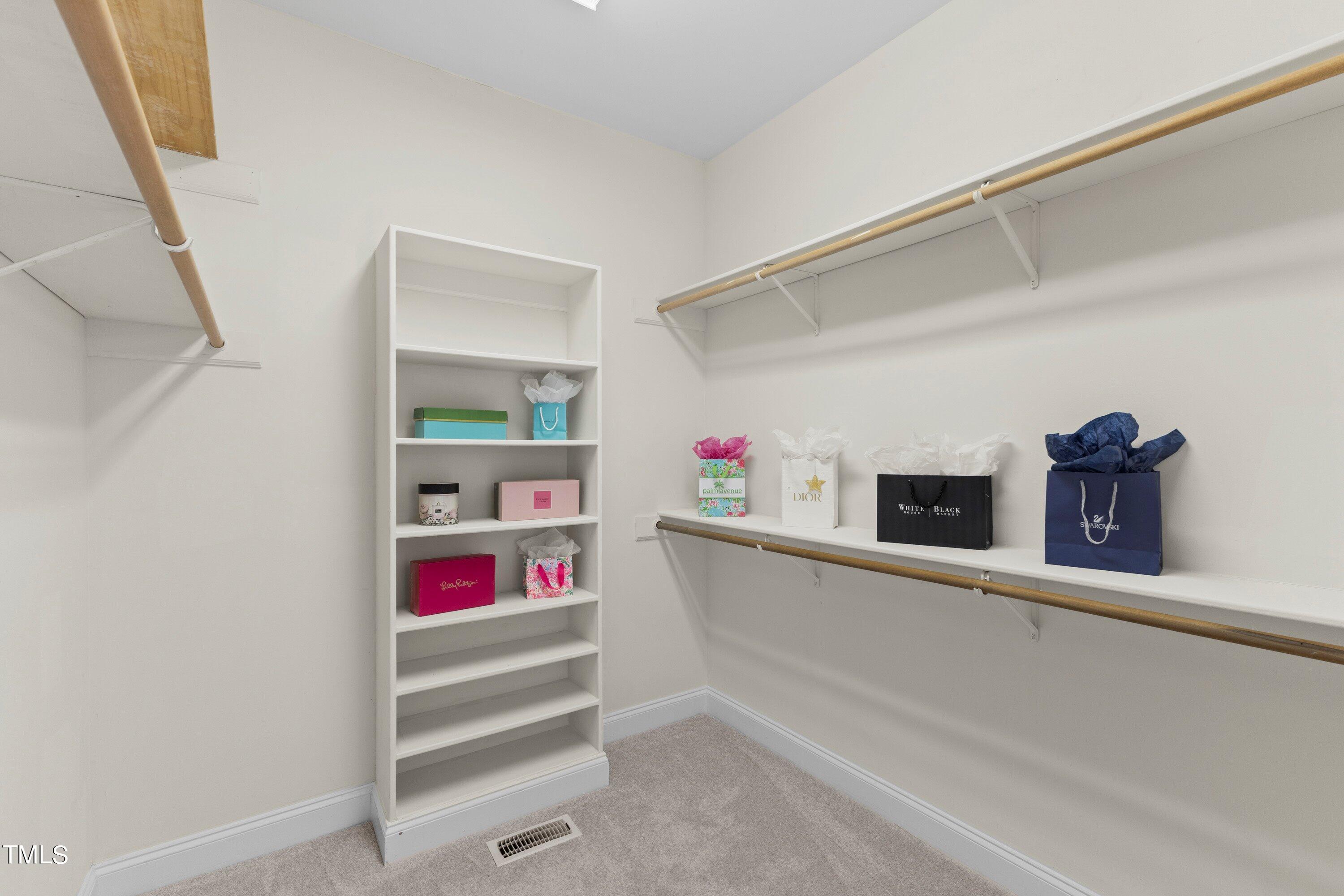 1004 Pasture View Lane Raleigh, NC 27603 - Photo 28 of 48 Oversized owner's closet with sweater cubbies and several racks for clothes.