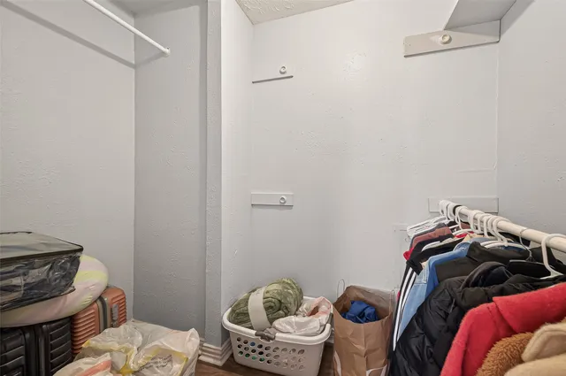 a view of a closet with storage
