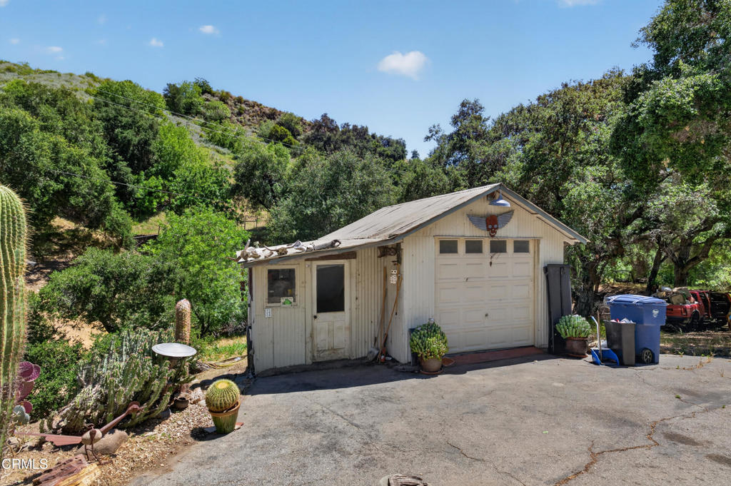 8416 Wheeler Canyon Road Santa Paula, CA 93060 - Photo 33 of 48 a front view of a house with a garden