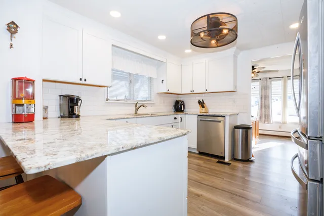 a kitchen with a sink cabinets and window