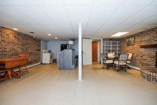 a view of a livingroom with furniture and a window