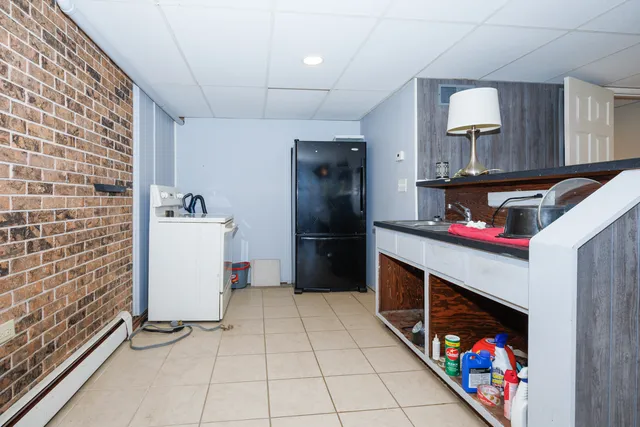 a kitchen with stainless steel appliances granite countertop a refrigerator and a stove