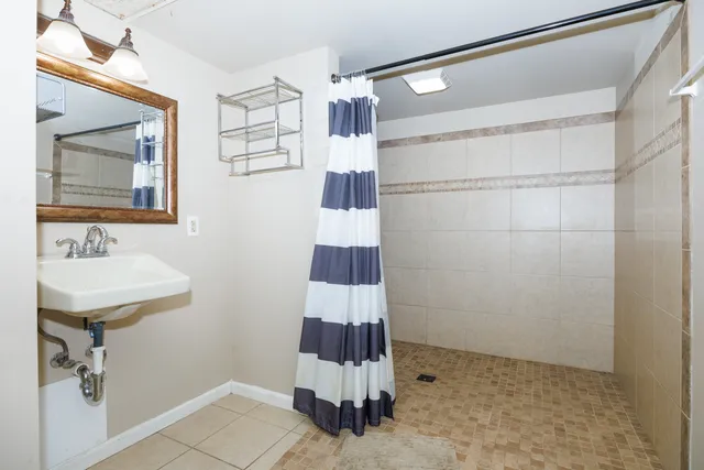 a bathroom with a sink and mirror