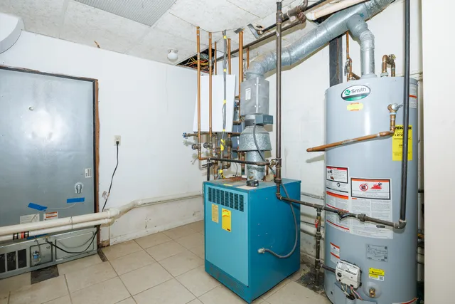 a kitchen with stainless steel appliances granite countertop a refrigerator and a stove