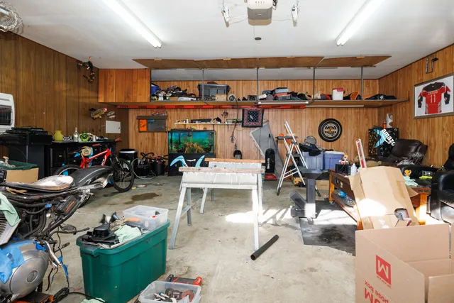 a view of a house with a yard and roof