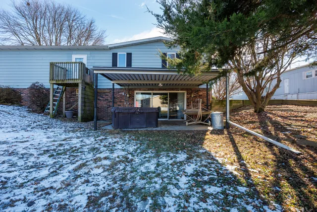 a view of a backyard with swimming pool