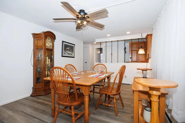 a view of a dining room with furniture and wooden floor