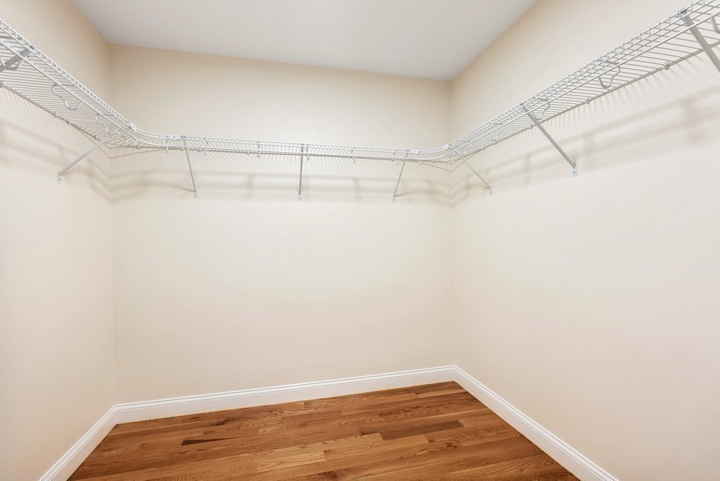 38 Gregory Street Waltham, MA 02451 - Photo 12 of 21 a view of a room with racks on the wall
