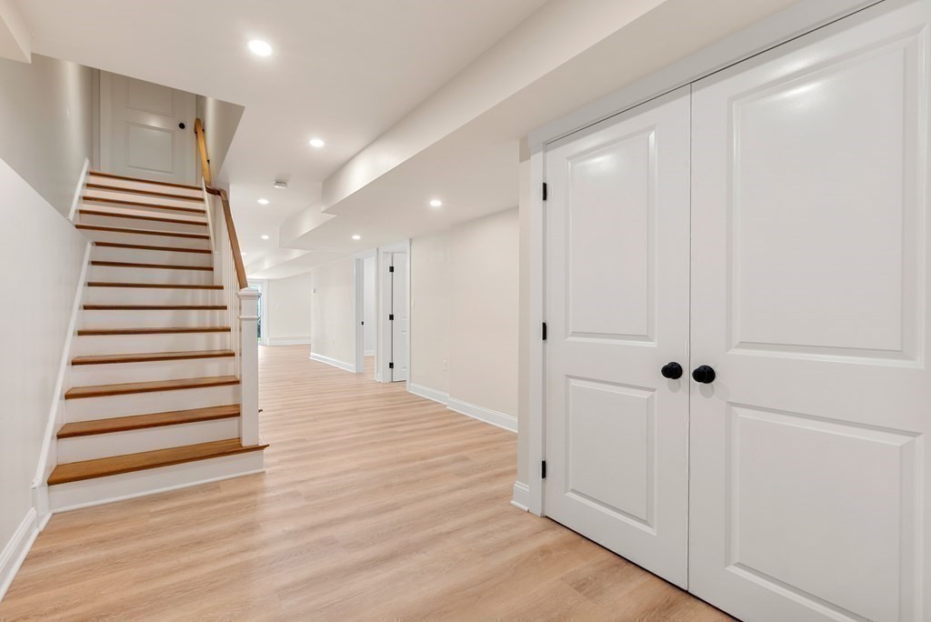 38 Gregory Street Waltham, MA 02451 - Photo 15 of 21 a view of a hallway with wooden floor