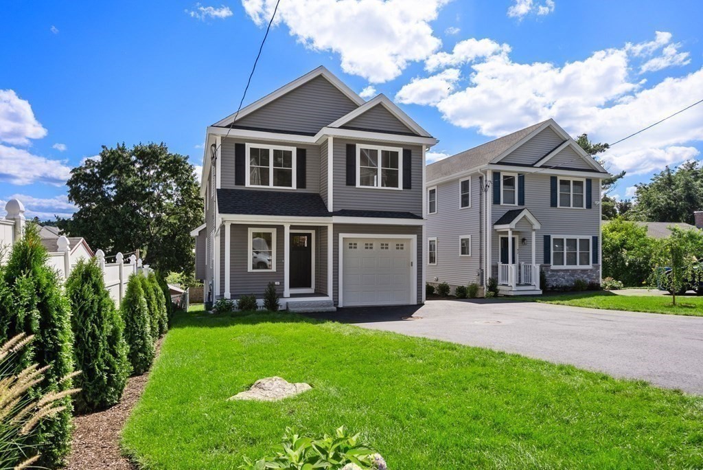 38 Gregory Street Waltham, MA 02451 - Photo 21 of 21 a front view of a house with a garden and trees