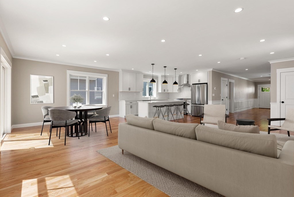 38 Gregory Street Waltham, MA 02451 - Photo 3 of 21 a living room kitchen with furniture and a dining table