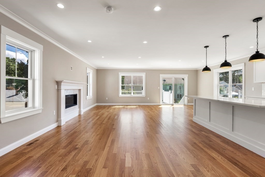 38 Gregory Street Waltham, MA 02451 - Photo 8 of 21 a view of a livingroom with furniture wooden floor and windows