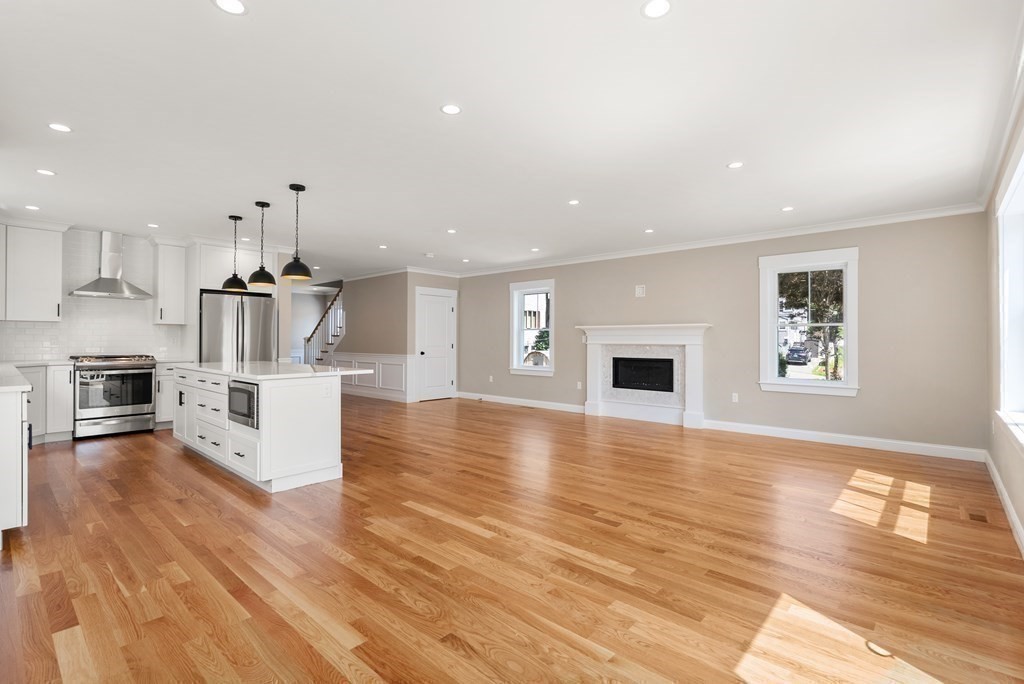 38 Gregory Street Waltham, MA 02451 - Photo 10 of 21 a view of kitchen with cabinets and wooden floor