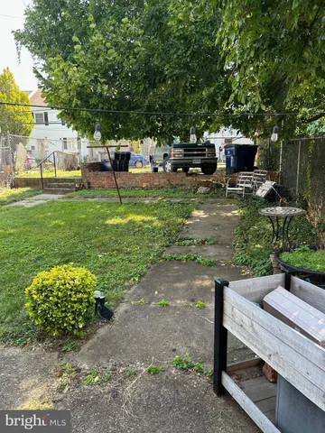 a view of a backyard with sitting area