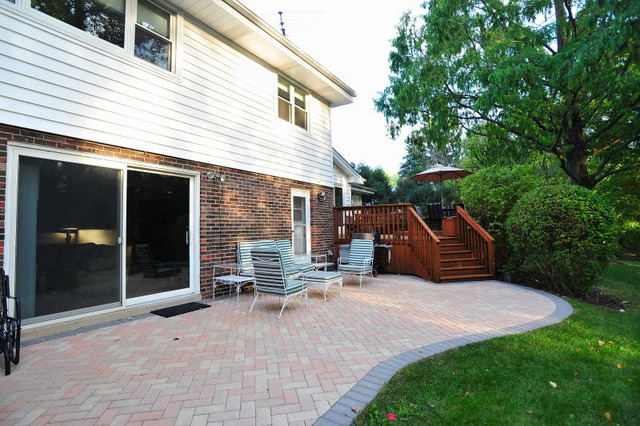 1826 Smith Road Northbrook, IL 60062 - Photo 20 of 22 a view of a patio with table and chairs and wooden fence