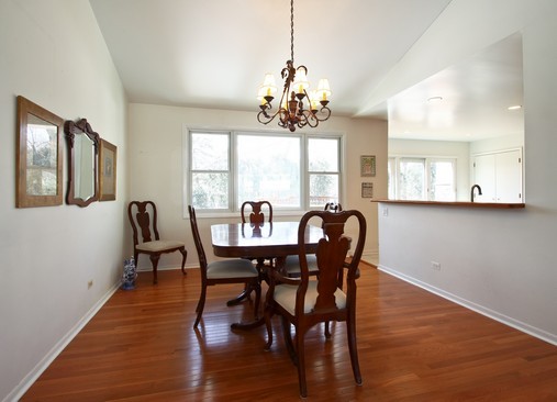 1826 Smith Road Northbrook, IL 60062 - Photo 5 of 22 a view of a dining room with furniture window and wooden floor