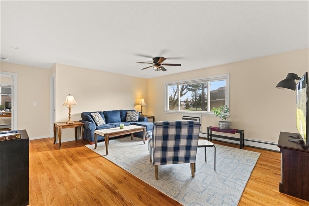 39 Will Drive, Unit 16 Canton, MA 02021 - Photo 5 of 13 a living room with furniture and a window