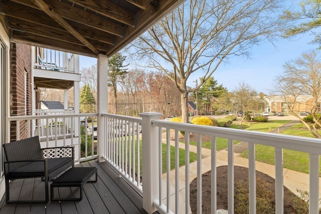 39 Will Drive, Unit 16 Canton, MA 02021 - Photo 9 of 13 a view of a chairs and table in the balcony