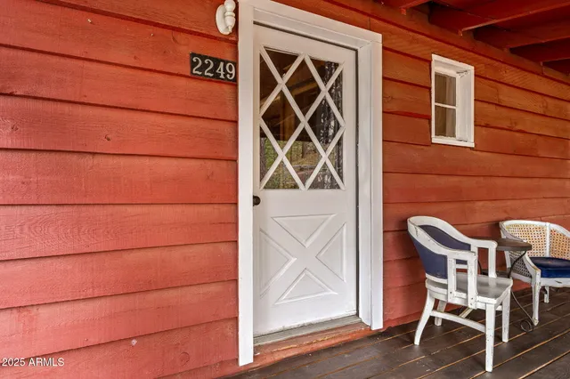 a view of a house with a tree and a big yard