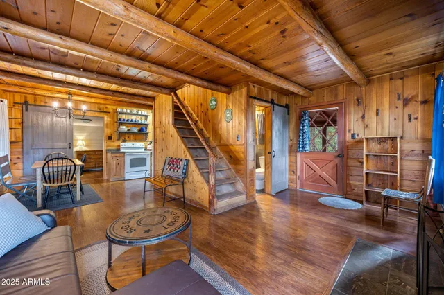 a livingroom with furniture and floor to ceiling window