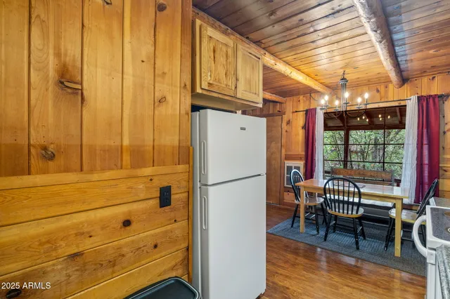 a dinning table and chairs in patio of the house