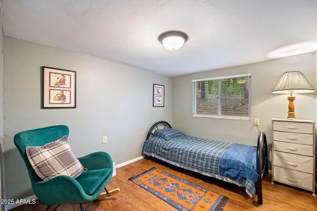 a bedroom with a bed and a dresser