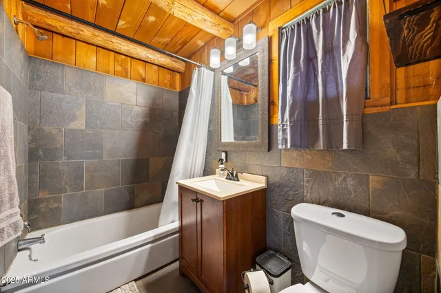 a bedroom with a bed and a view of bathroom