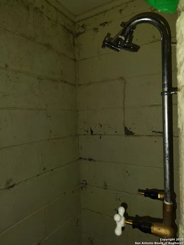 a bathroom with a sink a toilet and mirror