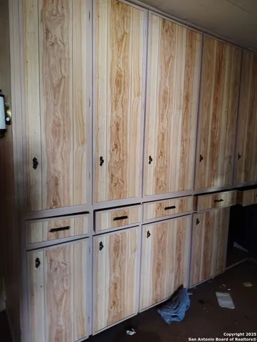 a living room with furniture and a gate