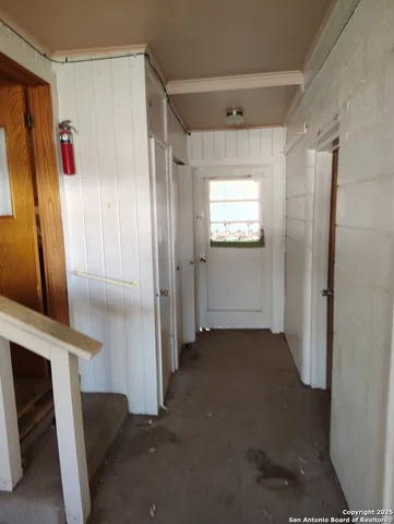 a kitchen with granite countertop cabinets and window