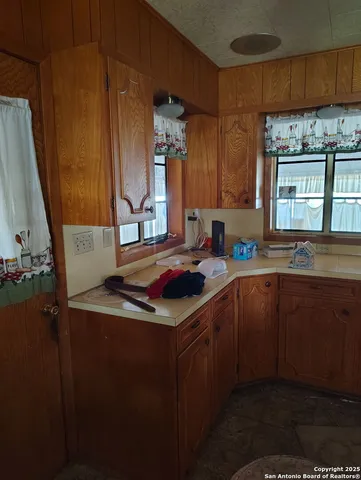 a kitchen with a sink and cabinets