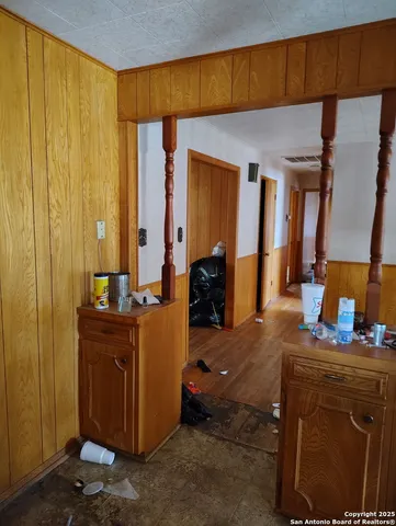 a view of a backyard with large trees