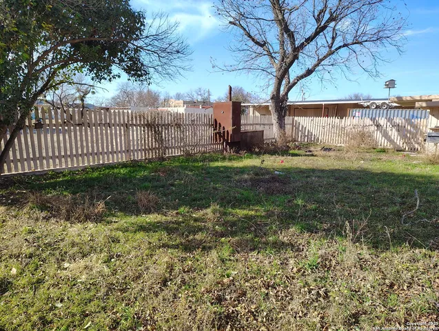 a view of a house with a tree