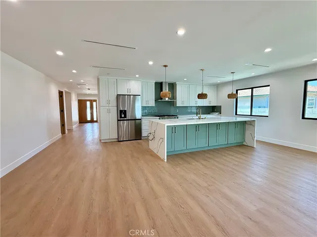 a view of kitchen with wooden floor and window