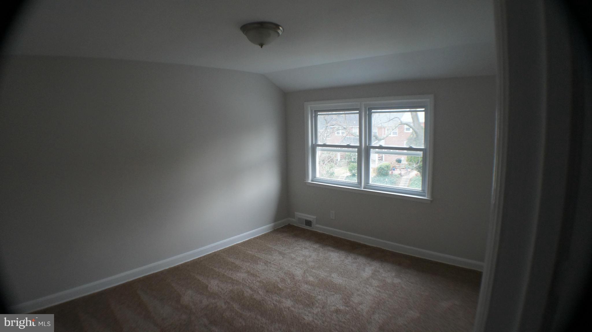1604 Pentwood Road Baltimore, MD 21239 - Photo 11 of 14 an empty room with a window