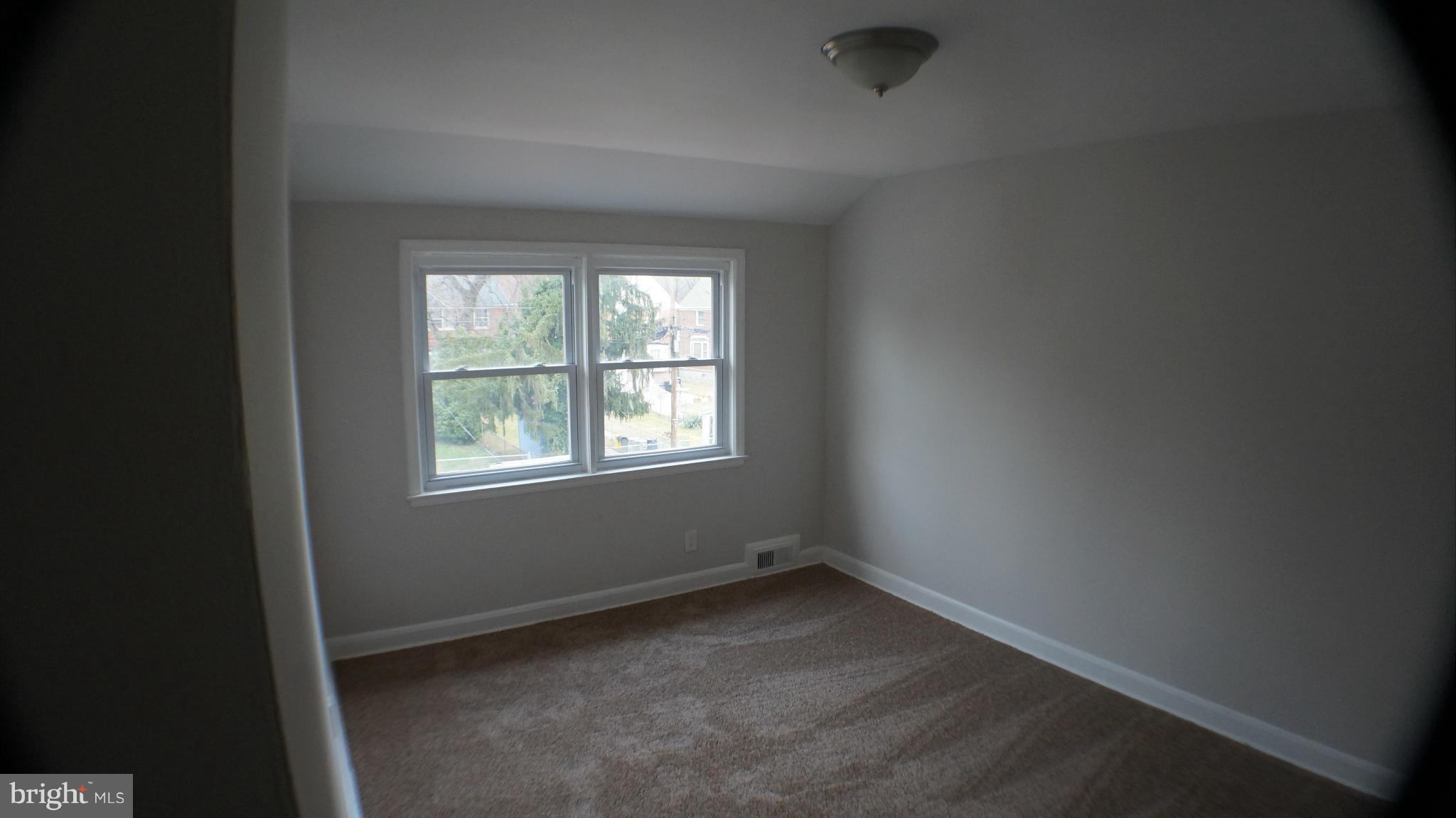 1604 Pentwood Road Baltimore, MD 21239 - Photo 12 of 14 an empty room with a window