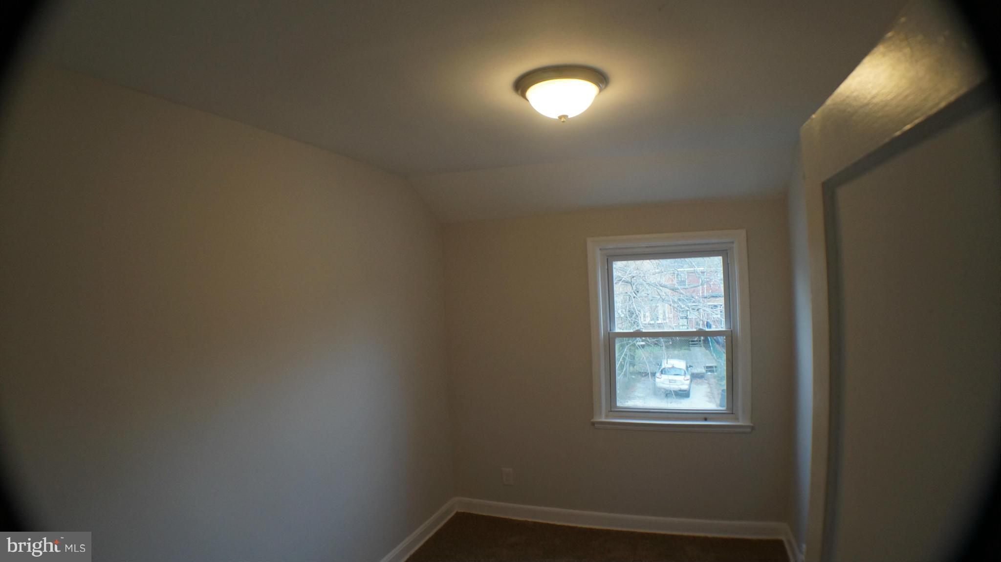 1604 Pentwood Road Baltimore, MD 21239 - Photo 13 of 14 an empty room with windows