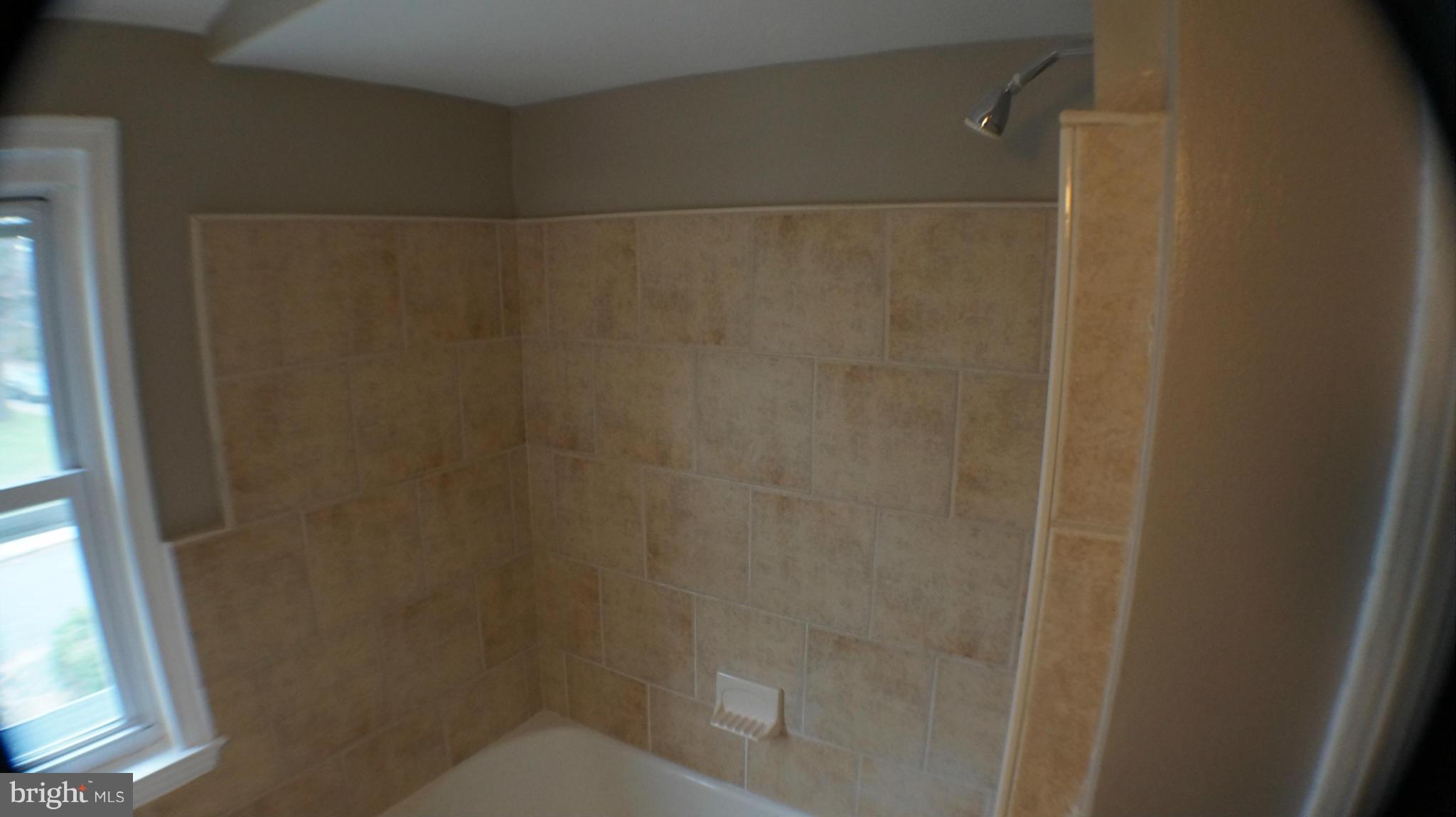 1604 Pentwood Road Baltimore, MD 21239 - Photo 14 of 14 a bathroom with a shower