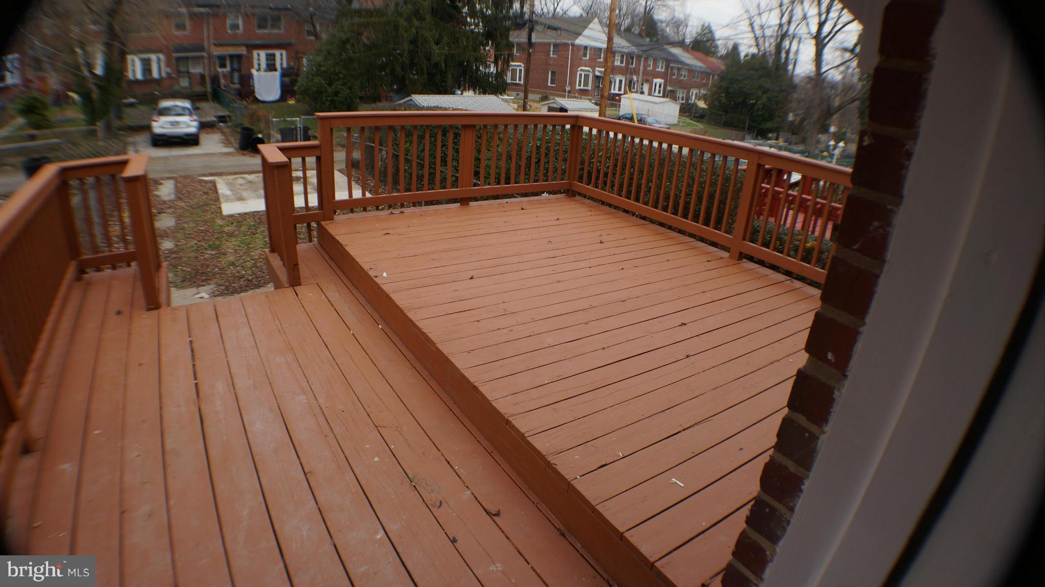 1604 Pentwood Road Baltimore, MD 21239 - Photo 7 of 14 a balcony with wooden floor