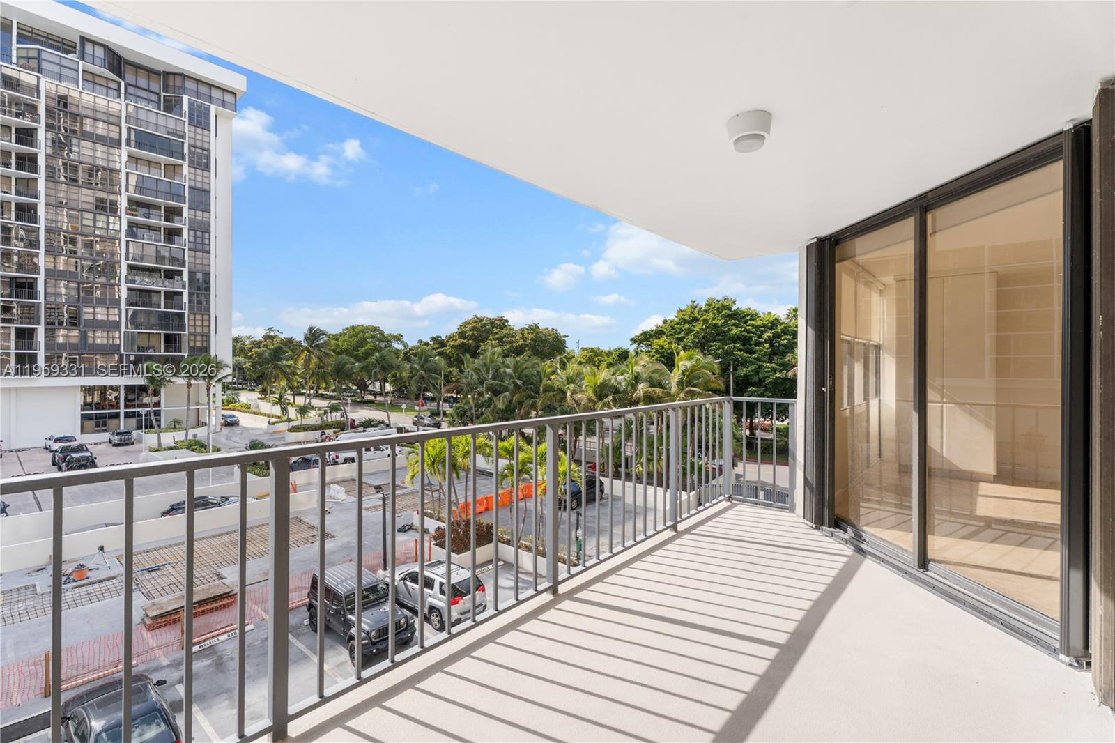 1901 Brickell Avenue, Unit B407 Miami, FL 33129 - Photo 13 of 27 a view of balcony with wooden floor and fence
