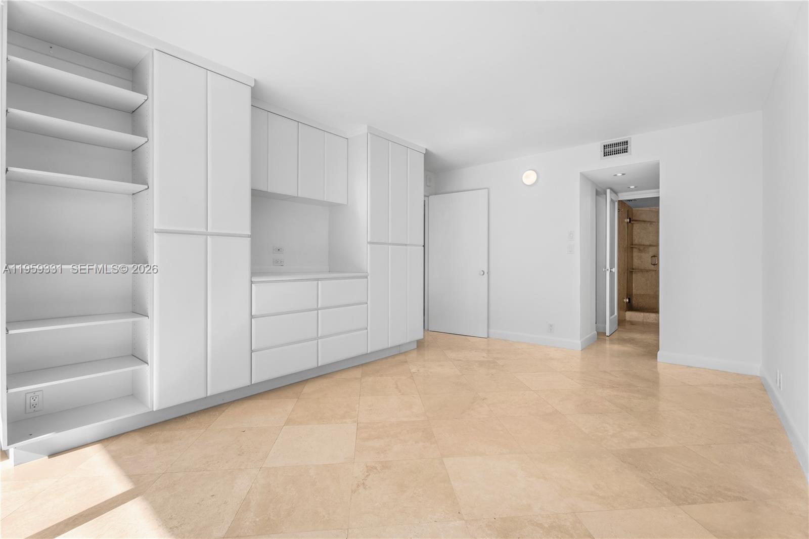 1901 Brickell Avenue, Unit B407 Miami, FL 33129 - Photo 8 of 27 a view of an empty room with a window