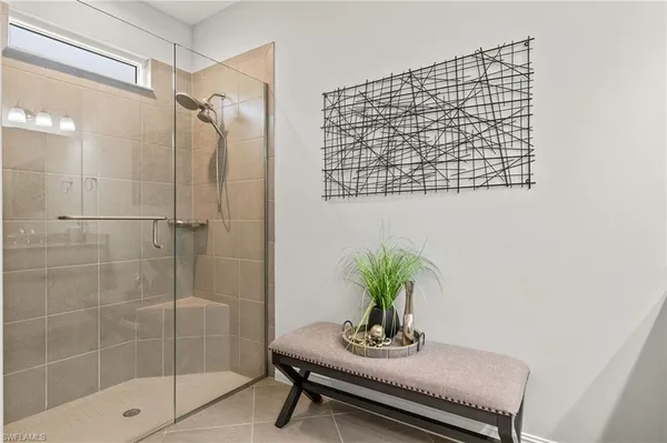 a bath room with a shower and a sink
